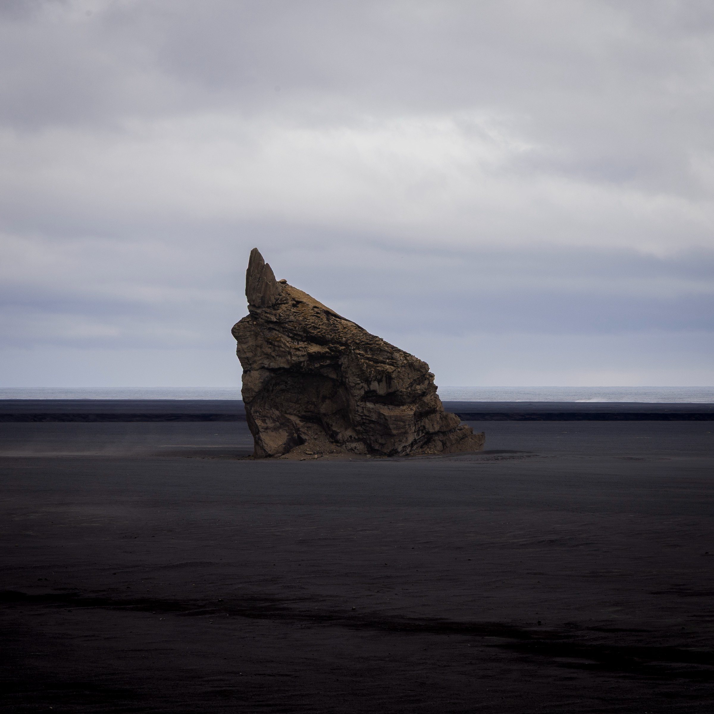 Rock on the black sand