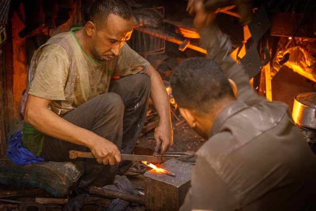 Blacksmiths at the forge